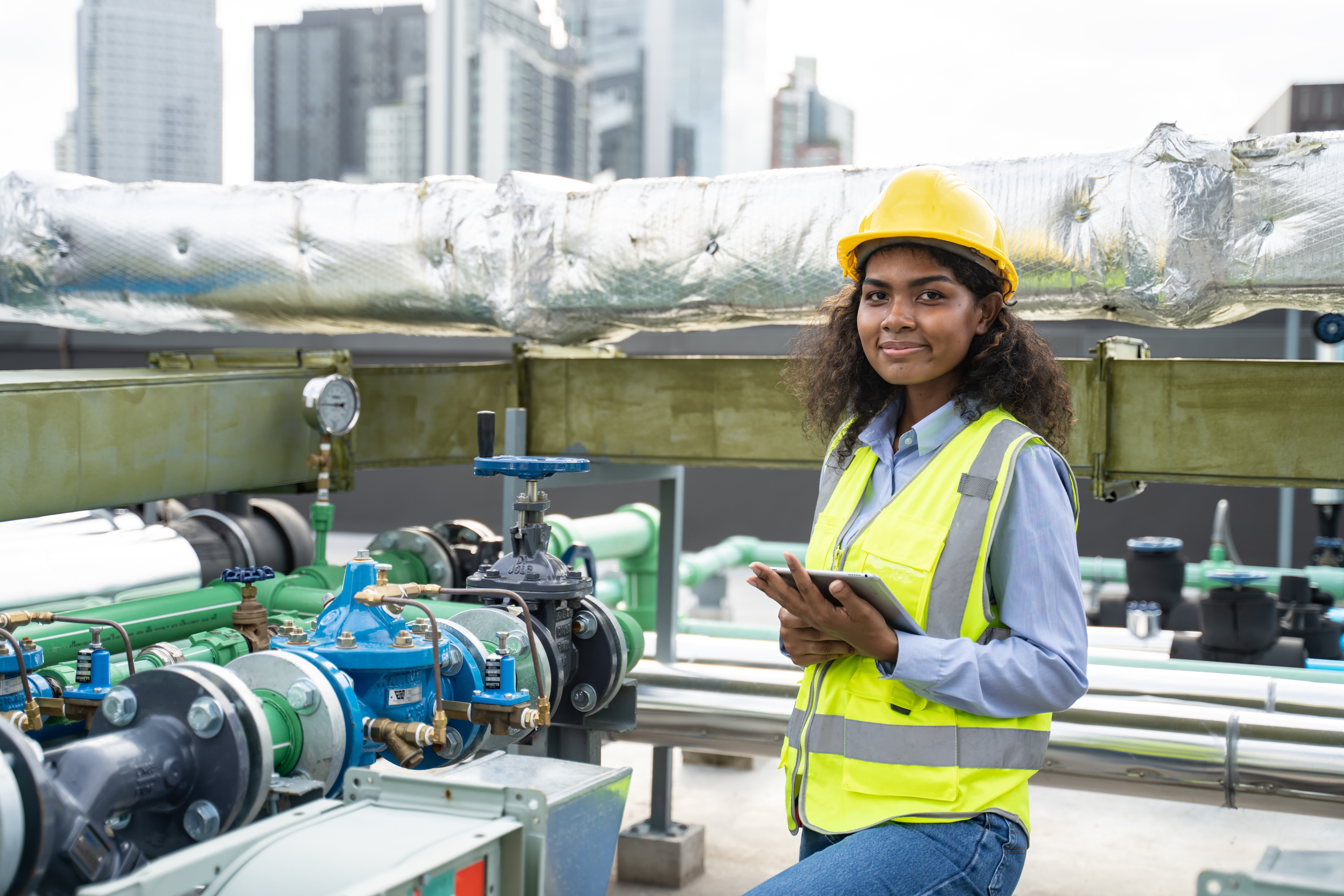 Woman on top of building, energy efficiency engineer
